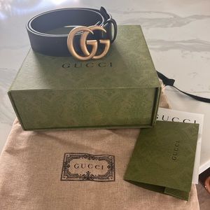 Gucci belt with receipt, duster bag and box.